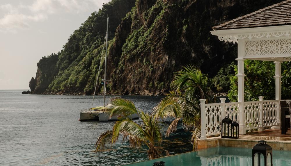 pool near ocean beside mountain