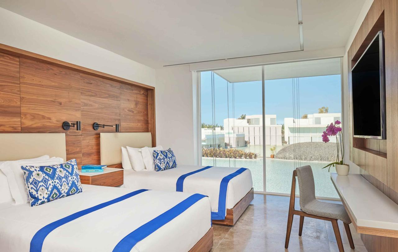 los cabos secondary bedroom with two double beds