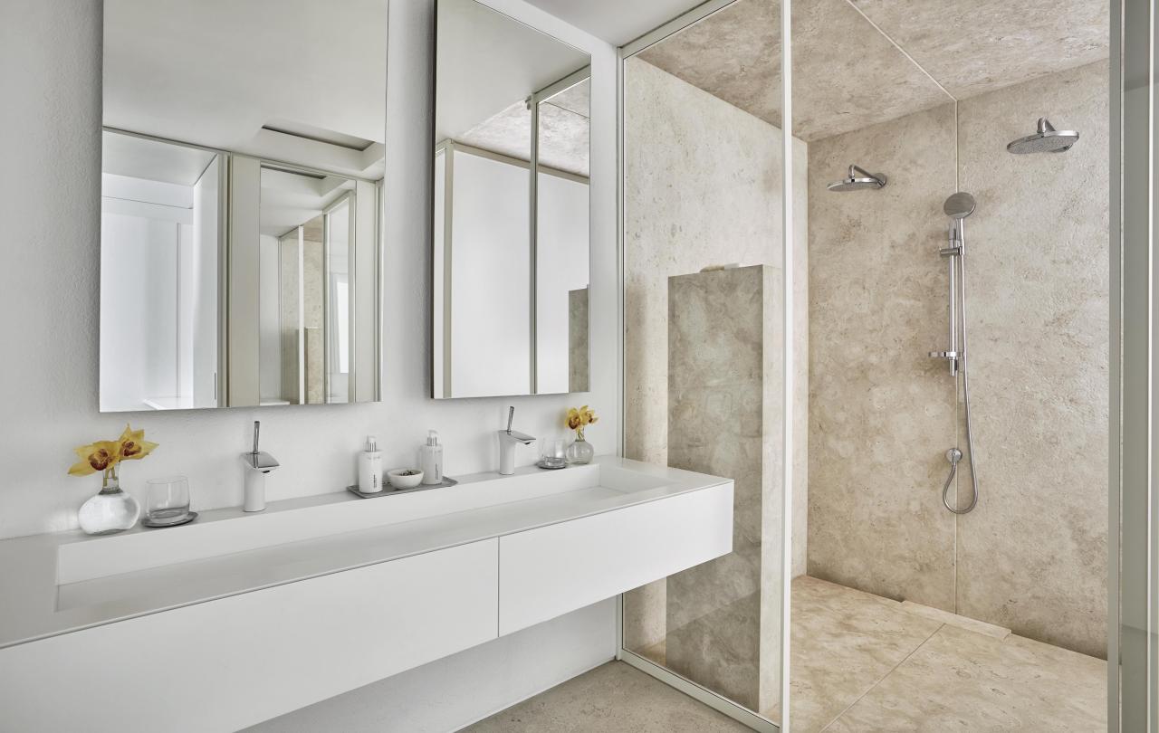 bathroom sink and shower in one bedroom suite