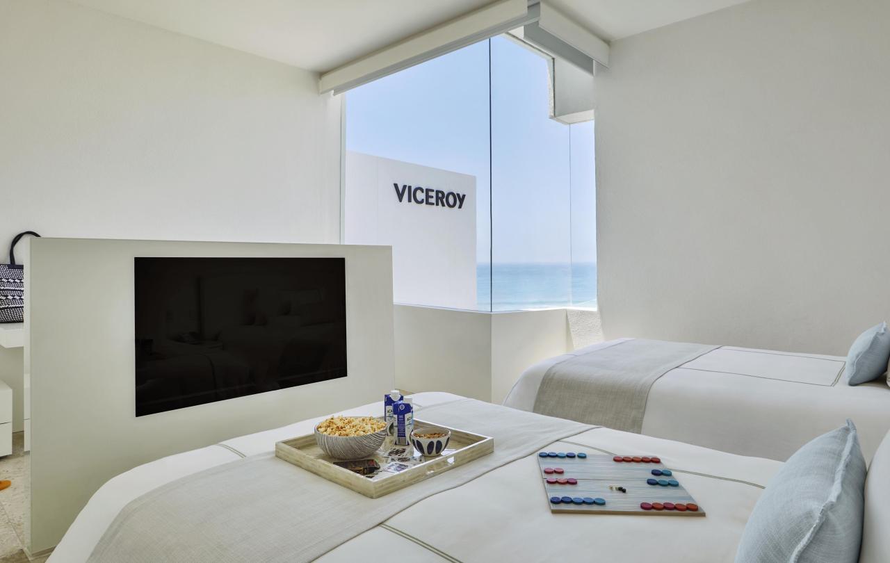 bedroom with TV in two bedroom suite