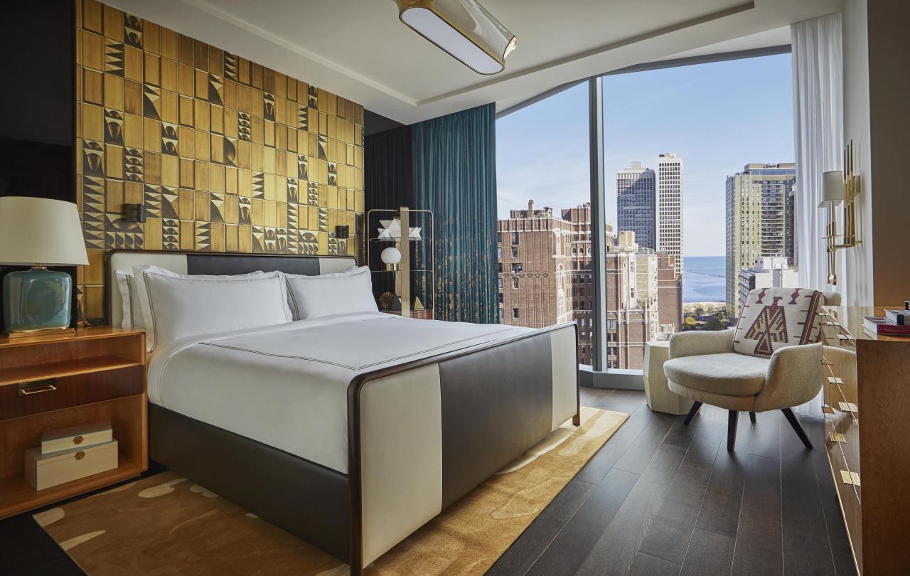 bedroom with king bed and view of the city