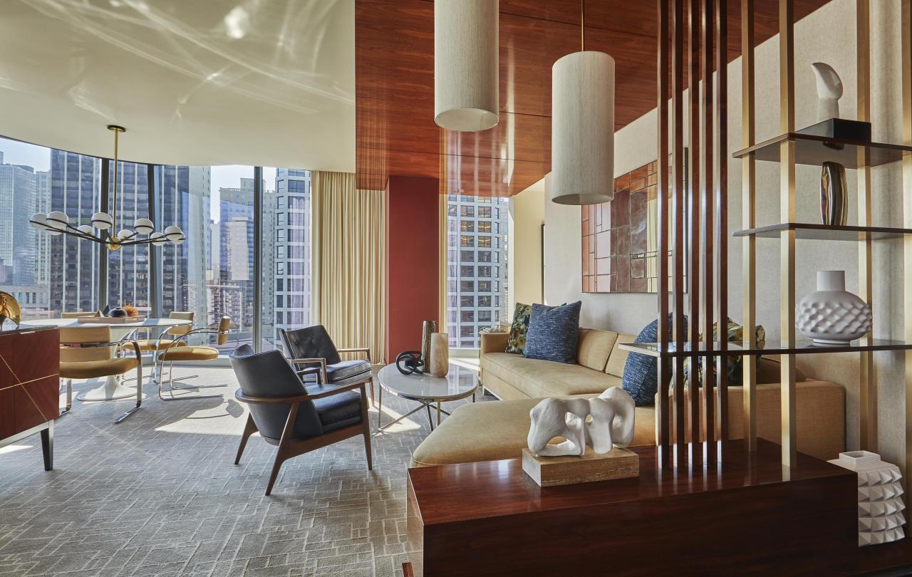 Large living room area with floor to ceiling windows