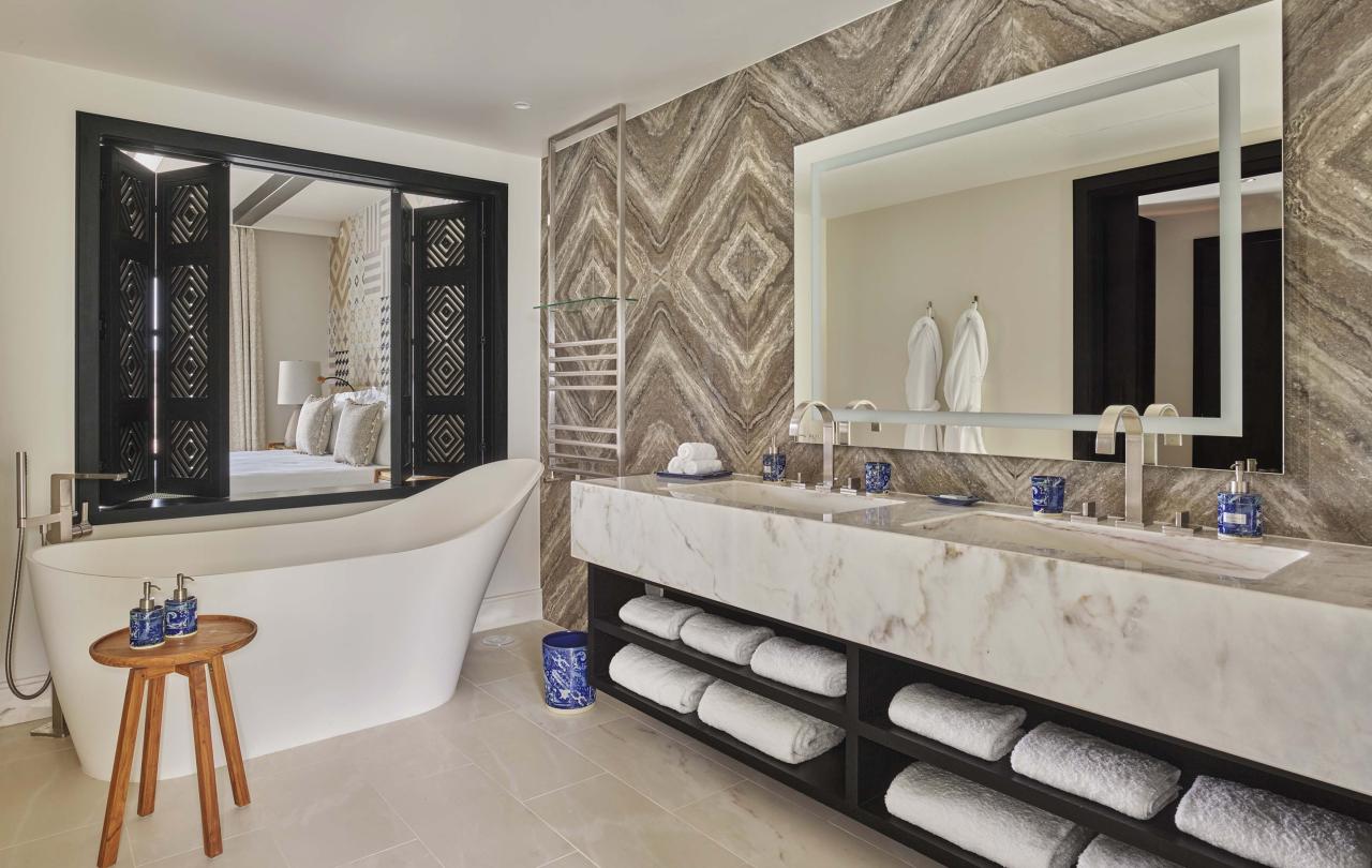 Bathroom with a two sink vanity and a soaking tub