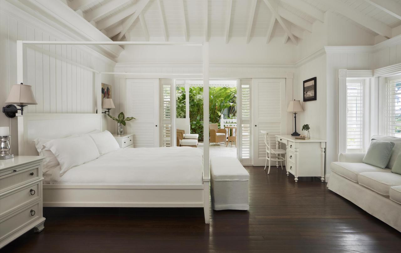 Bedroom with large bed and sofa