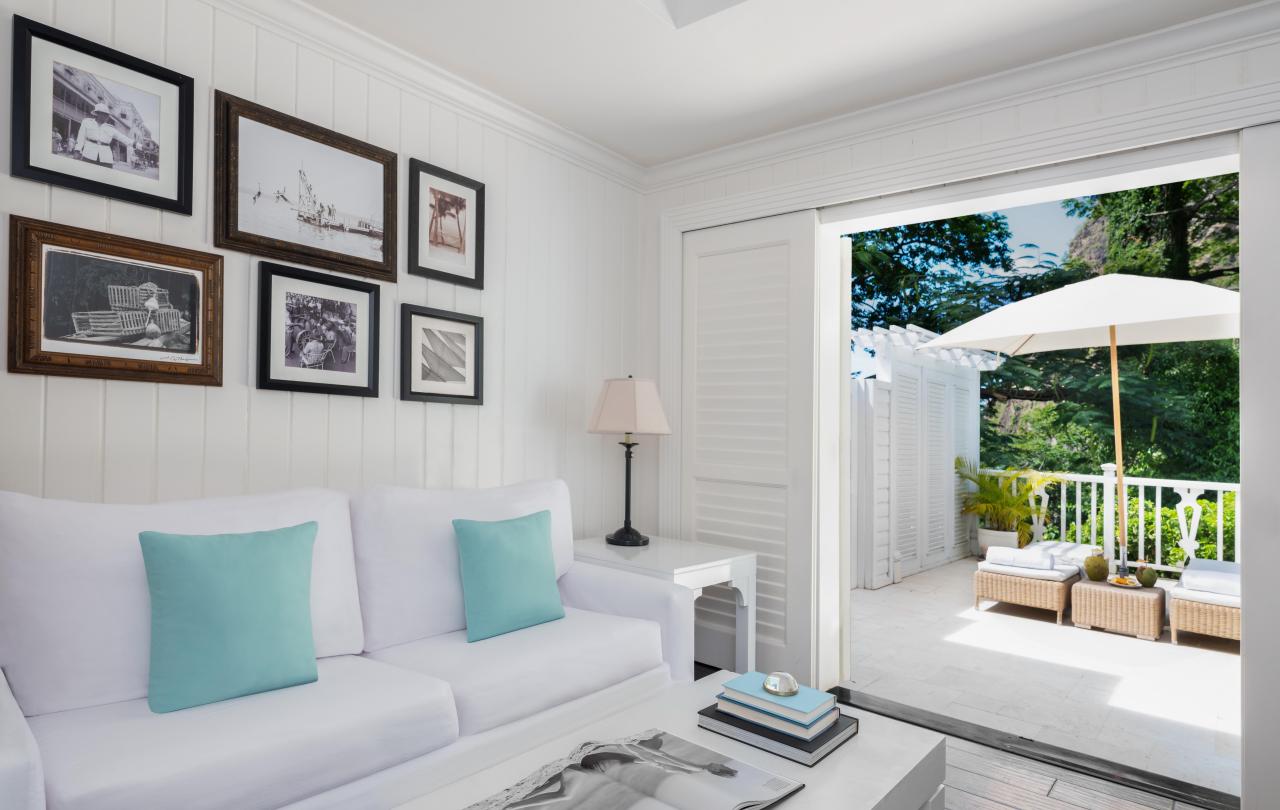 living room with white couch and photos hanging on the wall