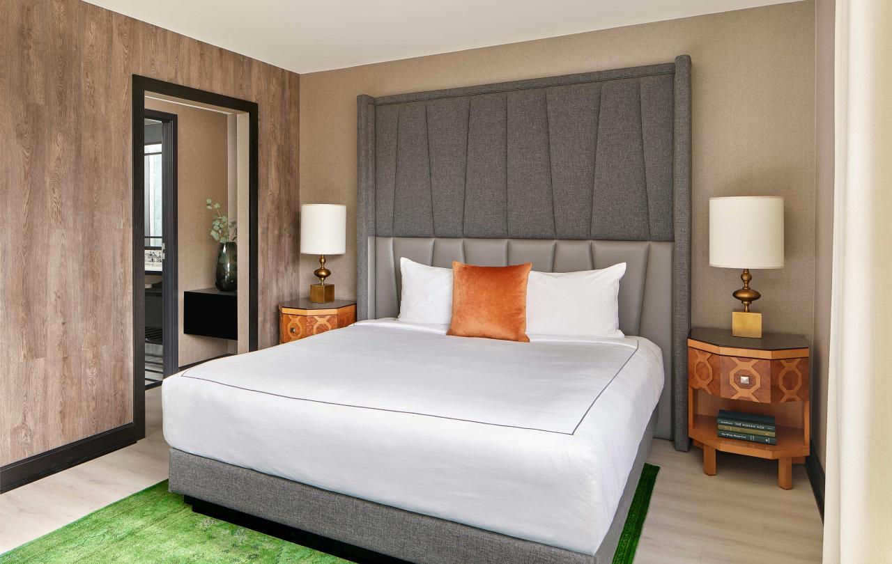 bedroom with king bed and green carpet