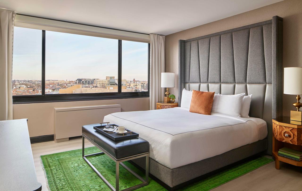 bedroom with king bed and a green rug