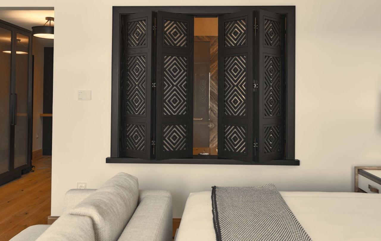 The side of a bed in a deluxe king room at Viceroy Ombria Algarve