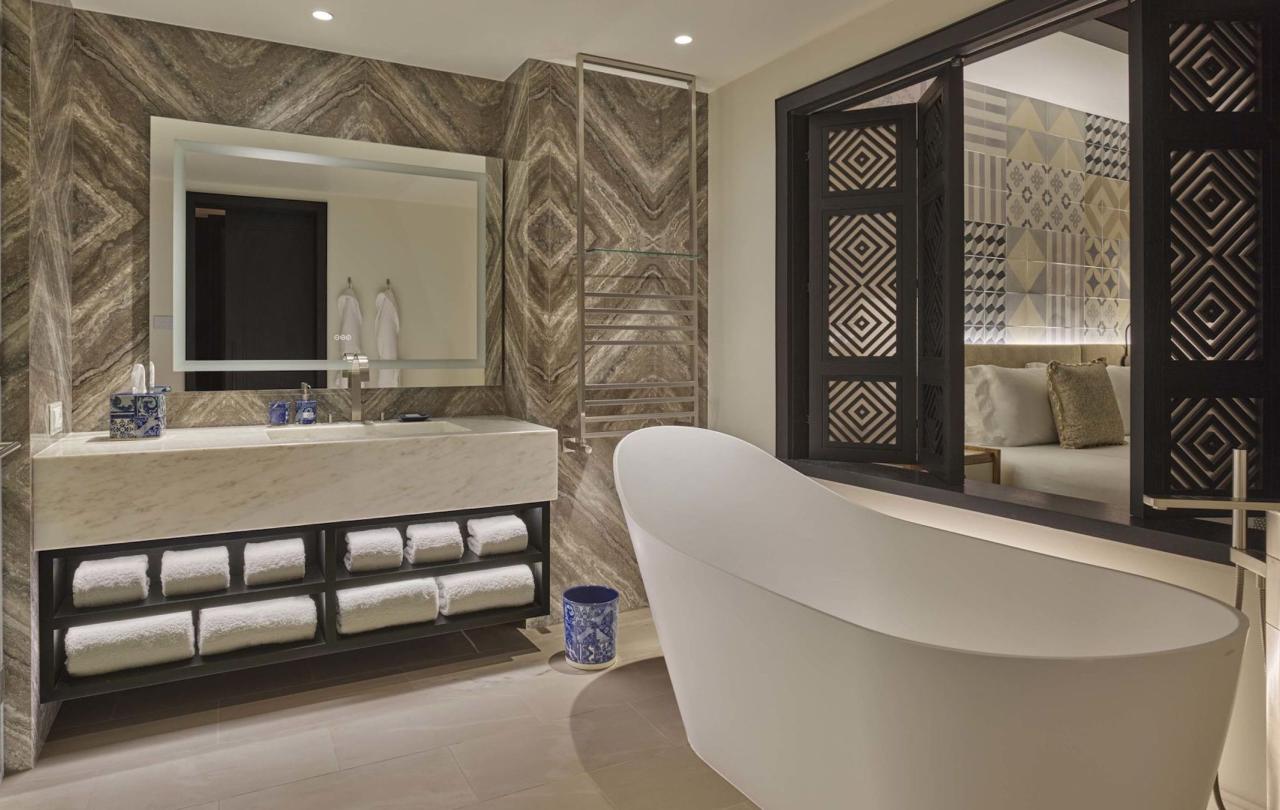 A soaker tub and vanity in a deluxe king room at Viceroy Ombria Algarve