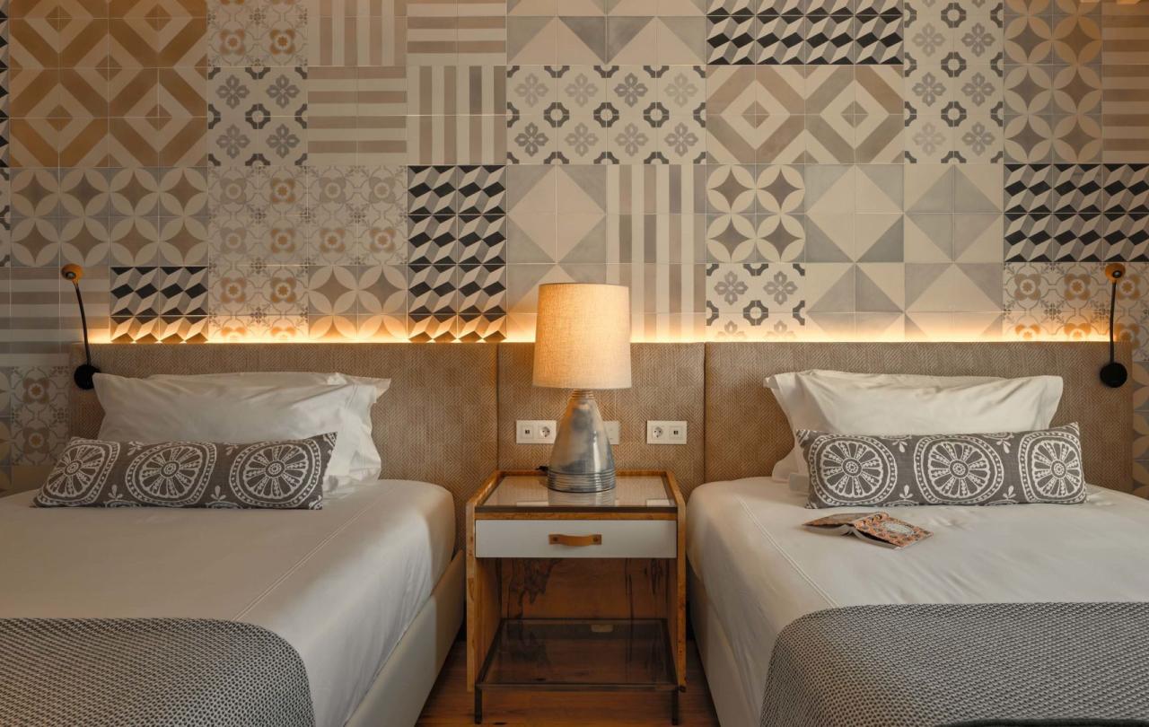 Two beds in a warm bedroom in two bedroom residence at Viceroy Ombria Algarve