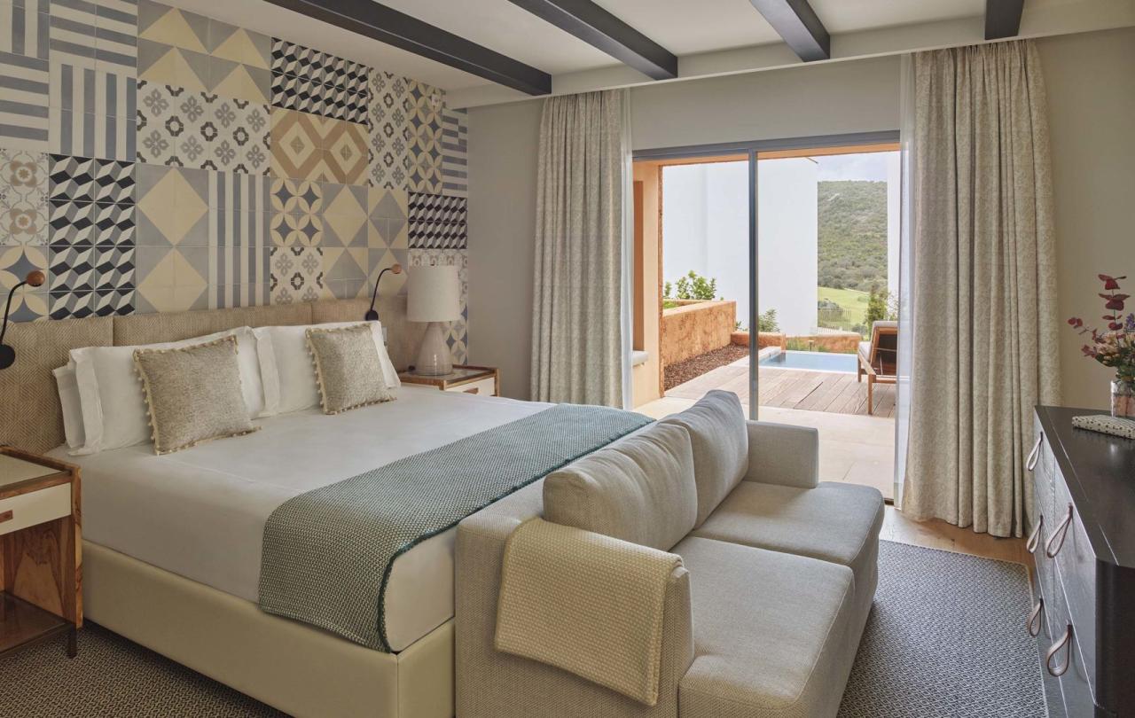 A warm bedroom with pool patio in two bedroom residence at Viceroy Ombria Algarve