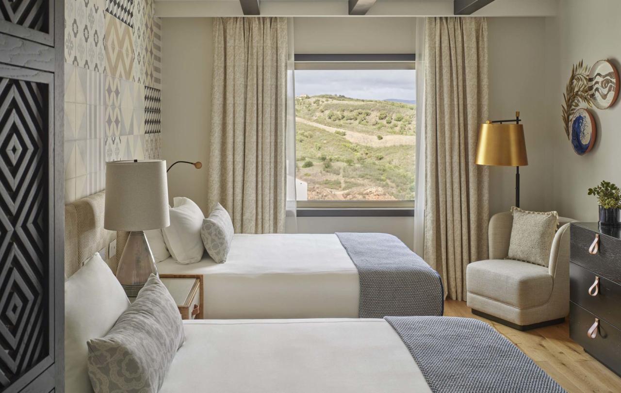 Two beds in a warm bedroom in two bedroom residence at Viceroy Ombria Algarve