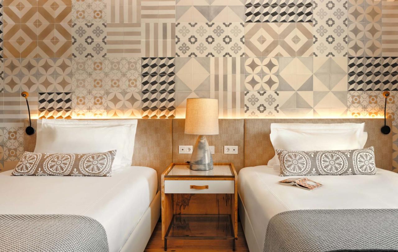 Two beds in a warm bedroom in two bedroom residence at Viceroy Ombria Algarve