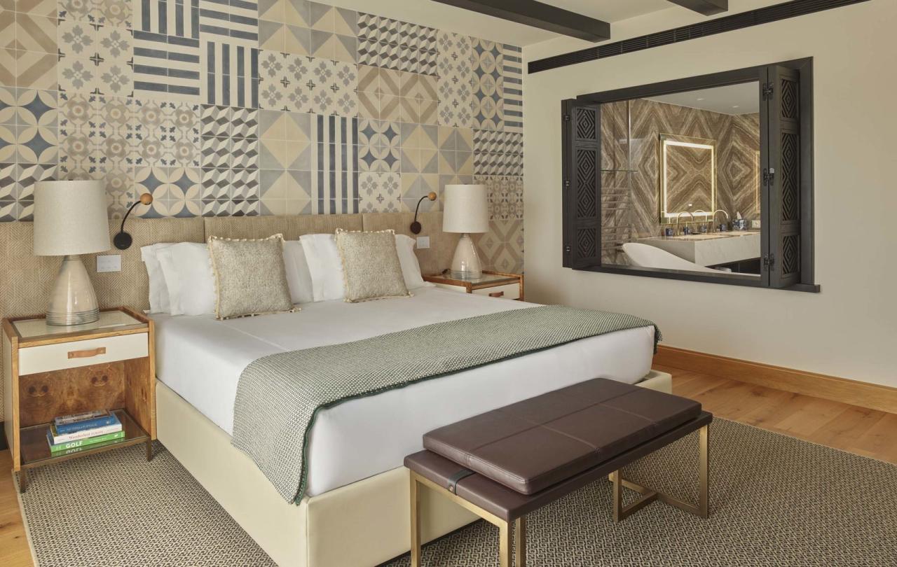 A warm bedroom with large bed in a two bedroom residence at Viceroy Ombria Algarve