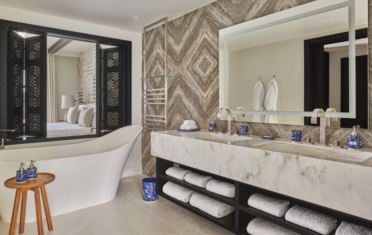 A large bathroom with double sink and deep tub in a two bedroom residence at Viceroy Ombria Algarve