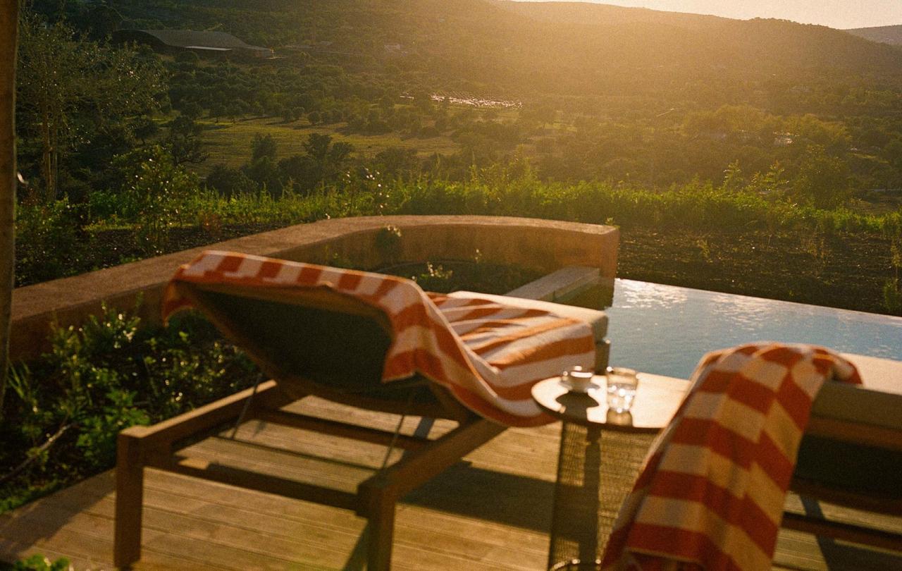 Two outdoor lounge chairs overlooking the valley at a two bedroom residence at Viceroy Ombria Algarve