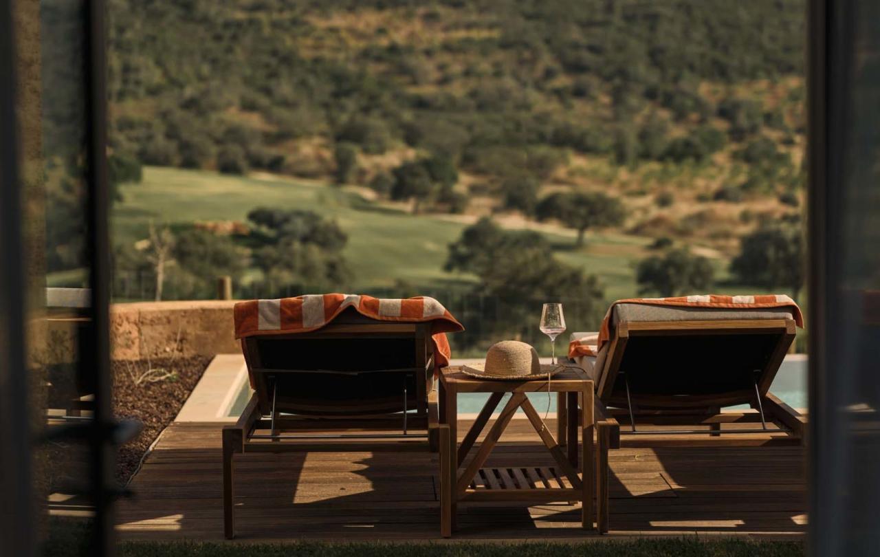 Two outdoor lounge chairs overlooking the valley at a two bedroom residence at Viceroy Ombria Algarve