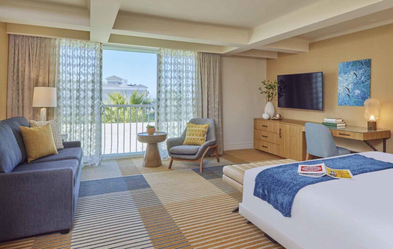 A room with a couch and a king bed at Viceroy Santa Monica