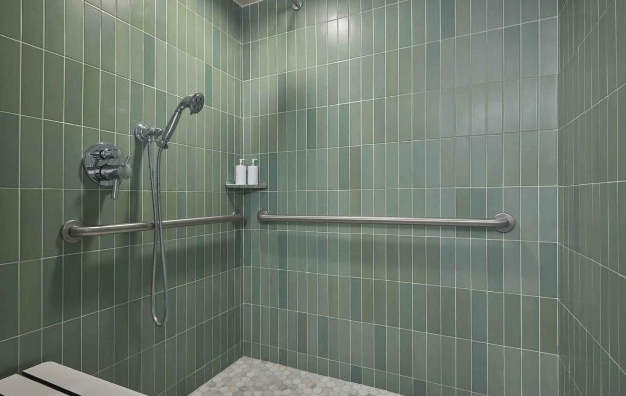 A green tiled shower in a suite at Viceroy Santa Monica
