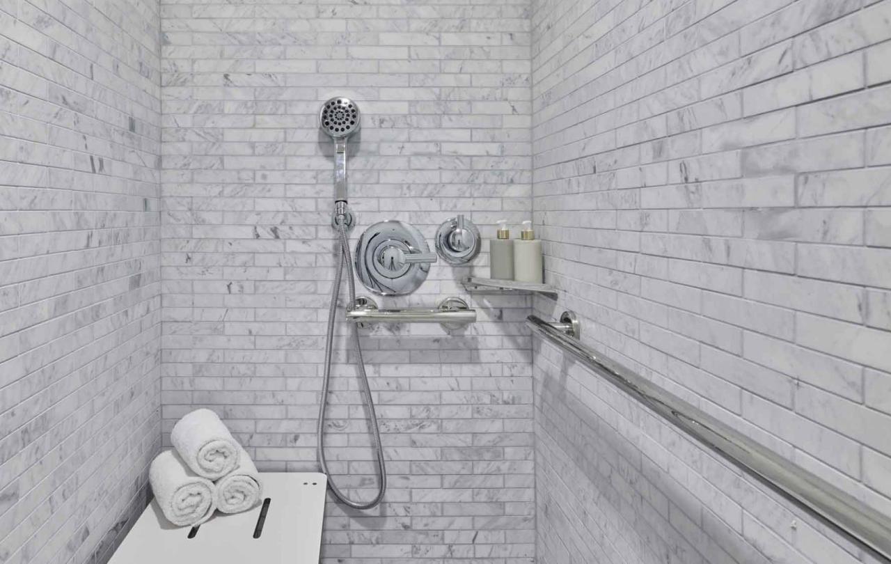 A shower head in side the shower of a room  in a room at Viceroy Santa Monica