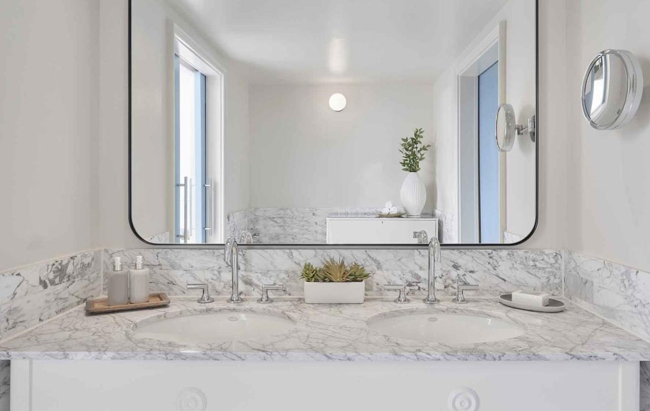 A one sink vanity with large mirror in a Junior Suite at Viceroy Santa Monica