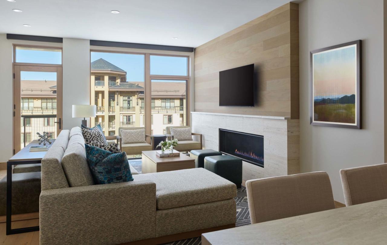 A well-appointed living room with a fireplace and a wall-mounted TV