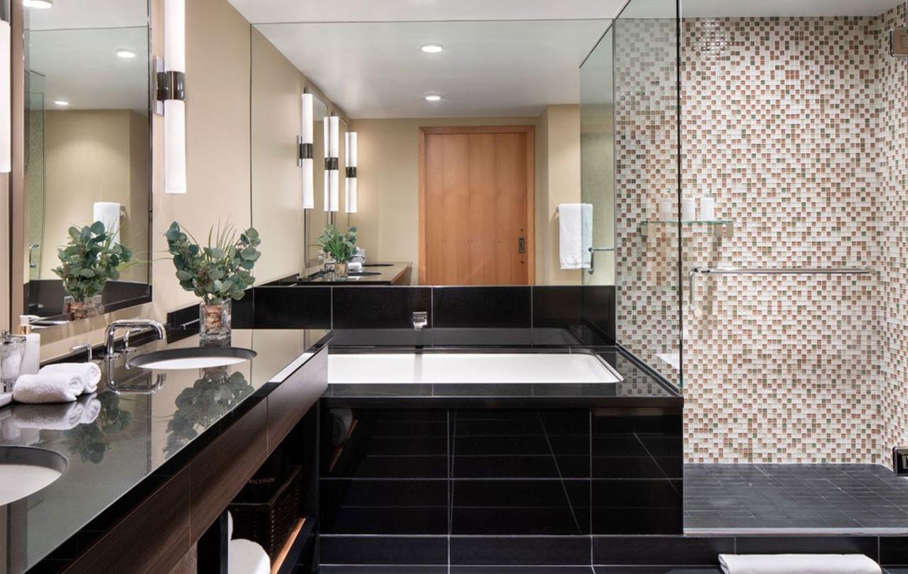 A large two sink vanity, shower and separate soaker tub in a pinnacle two bedroom residence at Viceroy Snowmass
