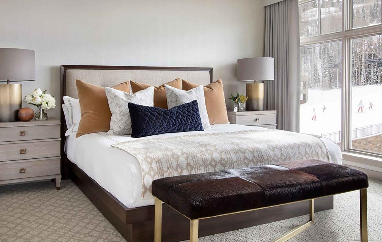 A king bed next to a patio in a Pinnacle Two Bedroom Premium Residence at Viceroy Snowmass