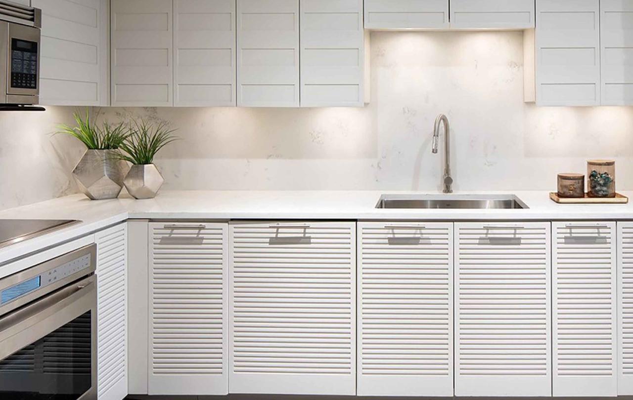 A beautiful white kitchen in a Pinnacle Two Bedroom Premium Residence at Viceroy Snowmass