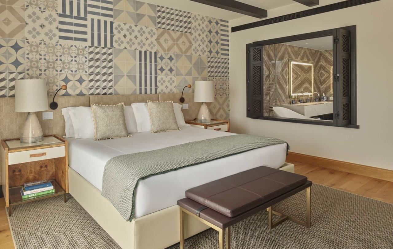 King bed with 2 side tables in a valley view room at Viceroy Ombria Algarve