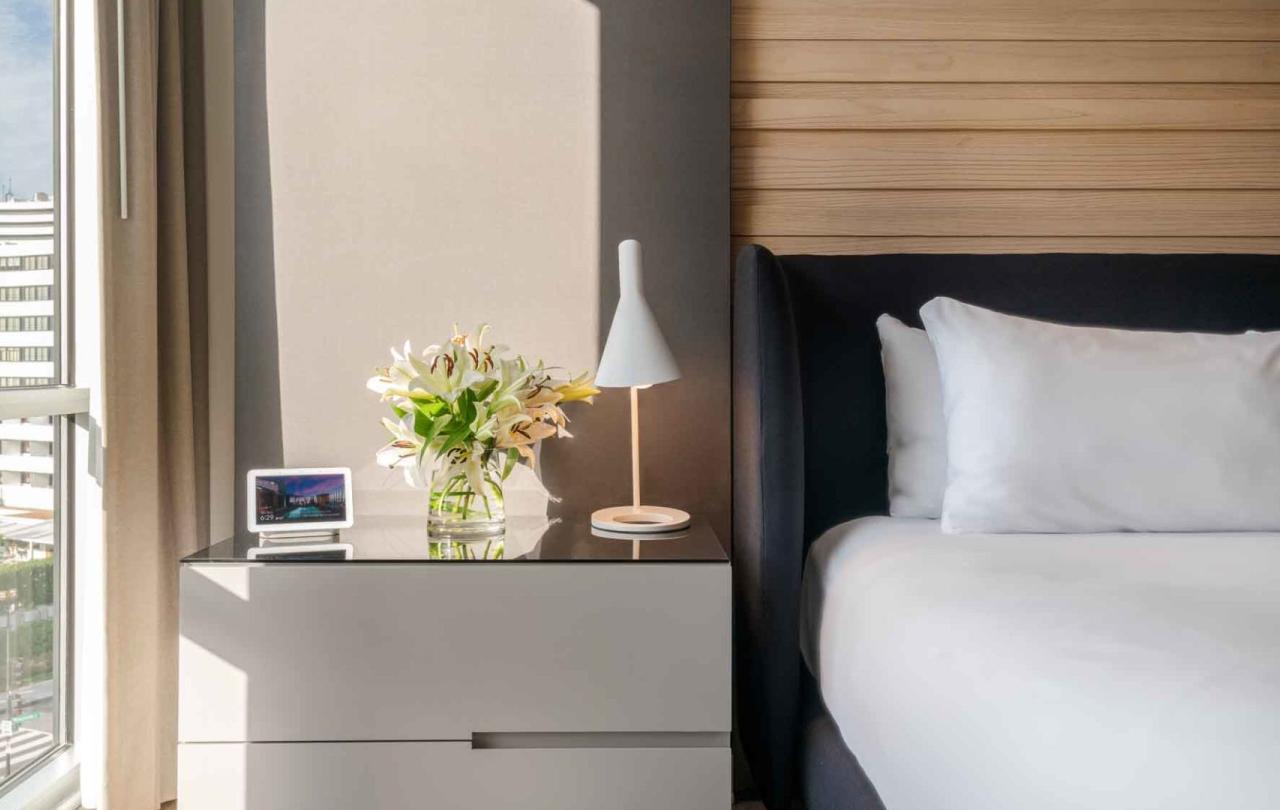 King bed and side table in a room at Viceroy Zena Washington