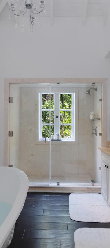 bathroom with claw tub and shower