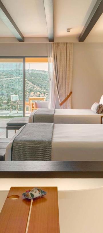 A view from the soaker tub to the bedroom in a standard room at Viceroy Ombria Algarve