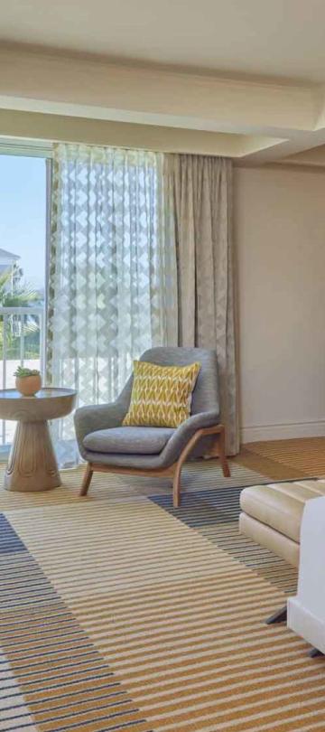 A room with a couch and a king bed at Viceroy Santa Monica
