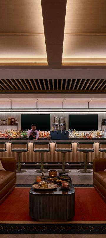 A bartender prepares a cocktail in the Viceroy Lounge at Viceroy Snowmass.
