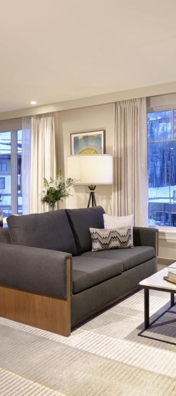 Bedroom with couch and fireplace at Viceroy Snowmass