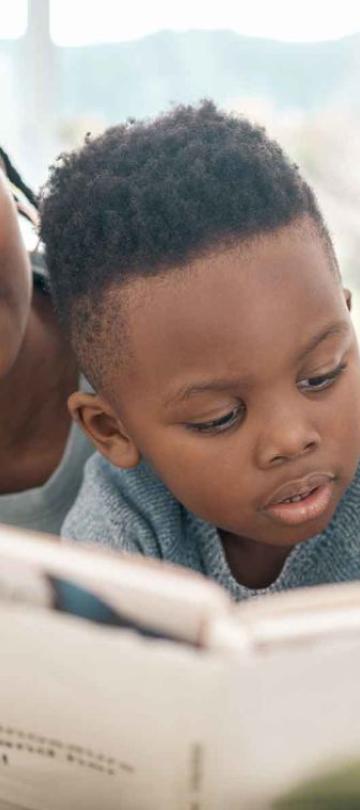 A woman reading to a child