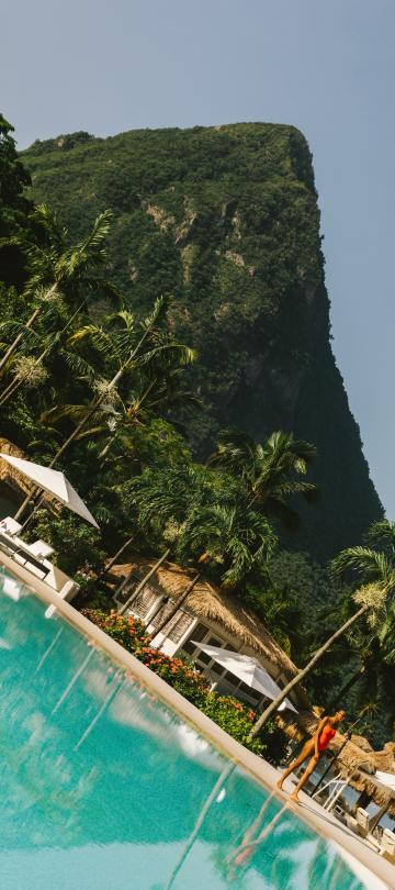 view of pool area with wooded peak in background