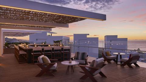 A rooftop patio at sunset, at Viceroy Los Cabos
