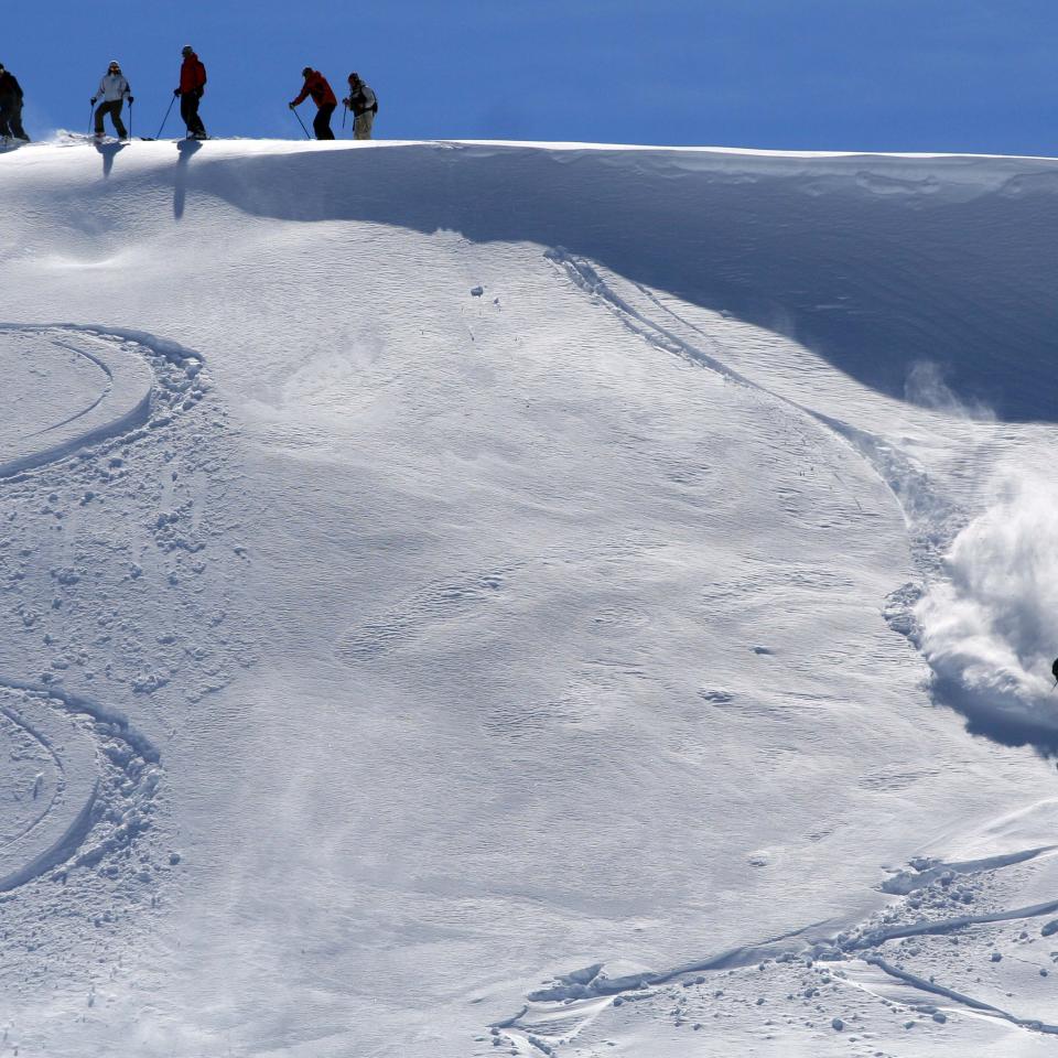A skiier descends off-piste on an unkempt slope in the Kopaonik mountains