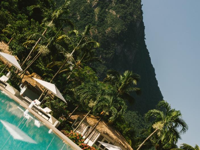 view of pool area with wooded peak in background
