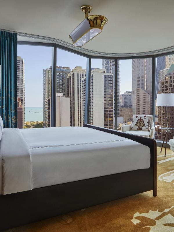 A suite at Viceroy Chicago with floor to ceiling windows and a beautiful view of Chicago 