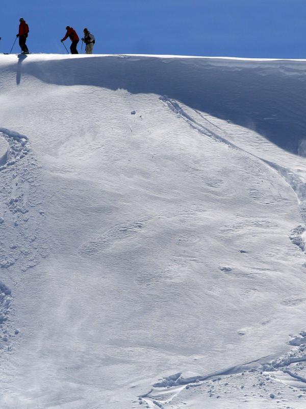 A skiier descends off-piste on an unkempt slope in the Kopaonik mountains