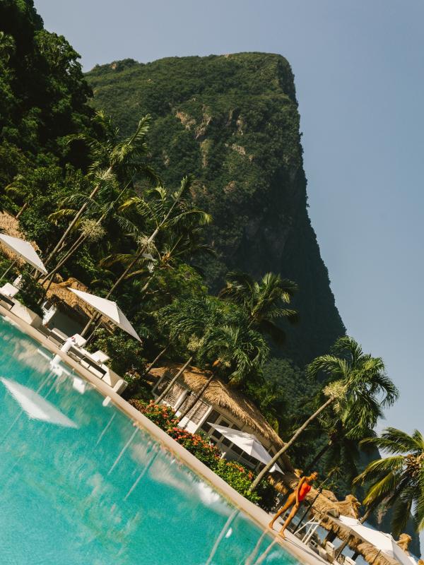 view of pool area with wooded peak in background
